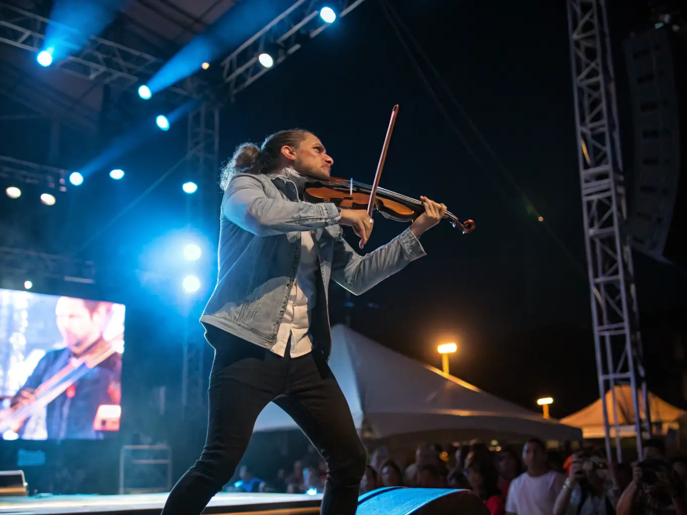 A violinist performing confidently on stage, highlighting the culmination of dedicated practice and expert preparation.